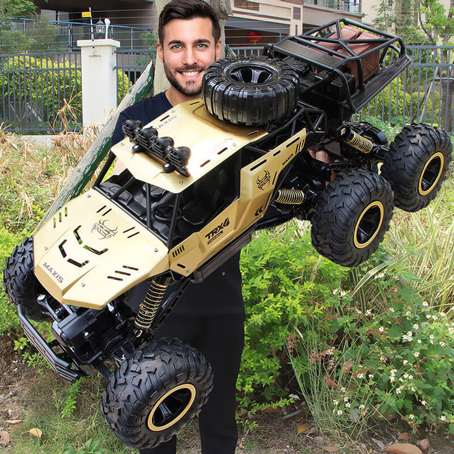 6x6 RC Monster Truck | 1/12 Schaal | All-Terrain Off-Road | 52 km/u | 2.4GHz Technologie | Schokbestendig | Antislipbanden | Zwart/Goud | Realistische Voorlichten | 7.4V 1200mAh Batterij | Voor Kinderen vanaf 6 Jaar | USB Opladen